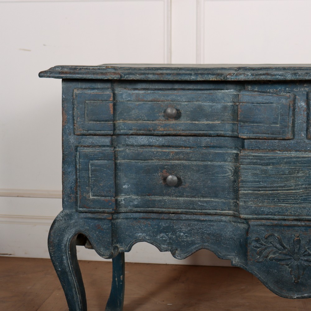 An 18th-century Portuguese serpentine commode featuring a blue painted finish, cabriole legs, and a carved apron. View IV