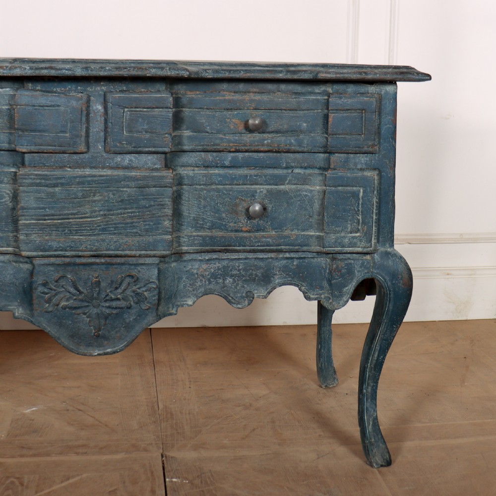 An 18th-century Portuguese serpentine commode featuring a blue painted finish, cabriole legs, and a carved apron. View VI