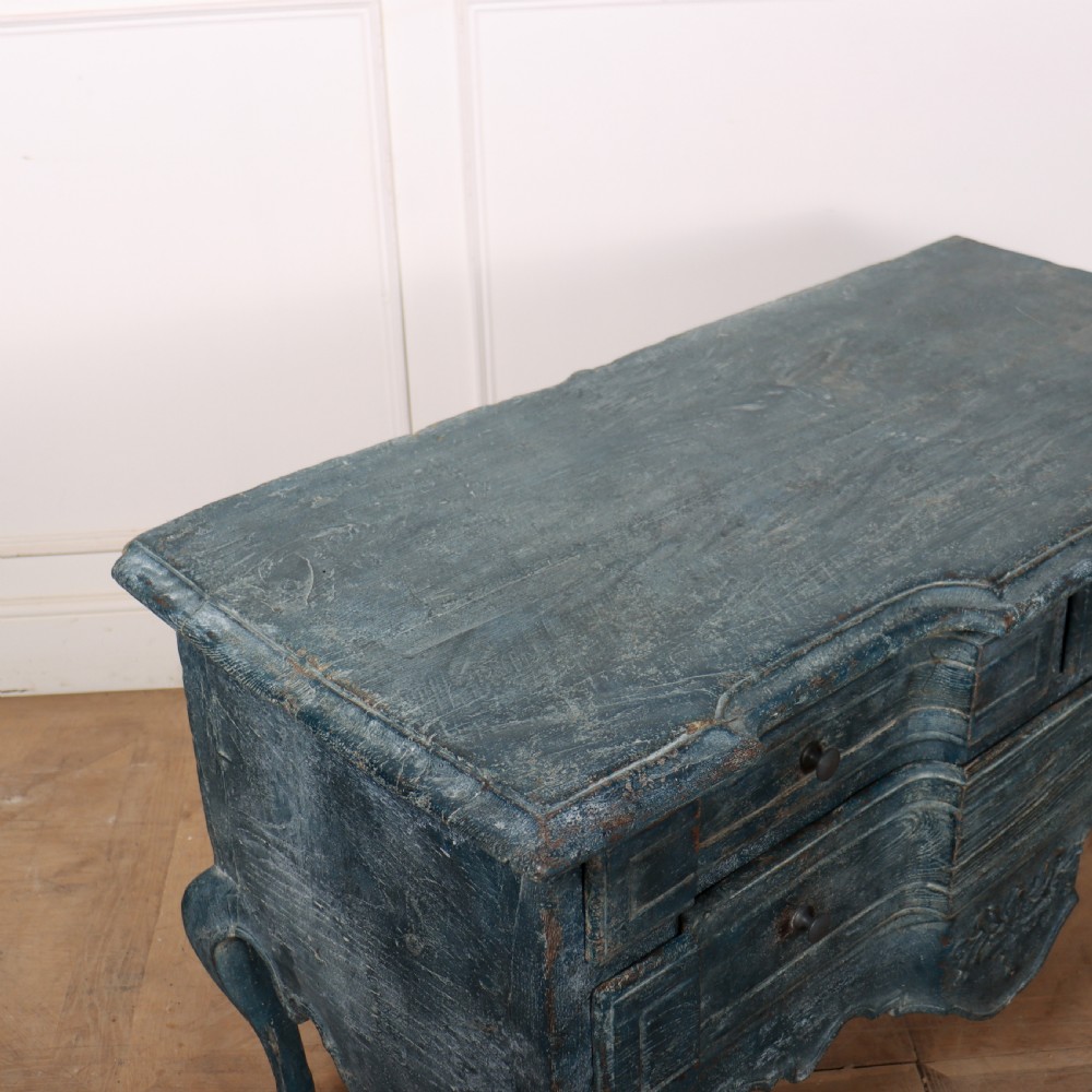 An 18th-century Portuguese serpentine commode featuring a blue painted finish, cabriole legs, and a carved apron. View VII