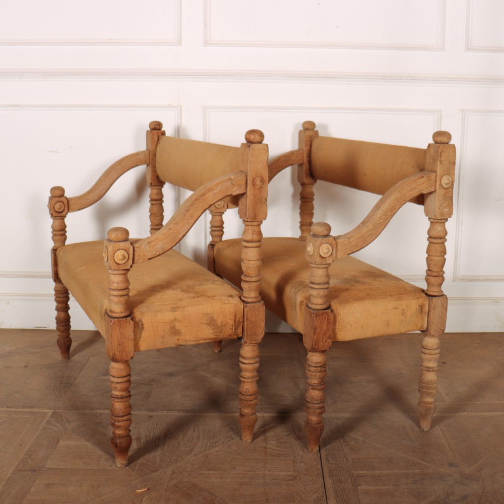 Pair of French bleached oak settles with turned legs, carved rosette details, and neutral canvas upholstery. View III