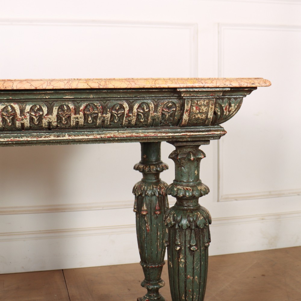 A French pastry table featuring a polished light pink marble top supported by a carved distressed green painted wood base with an undertier shelf. View IV