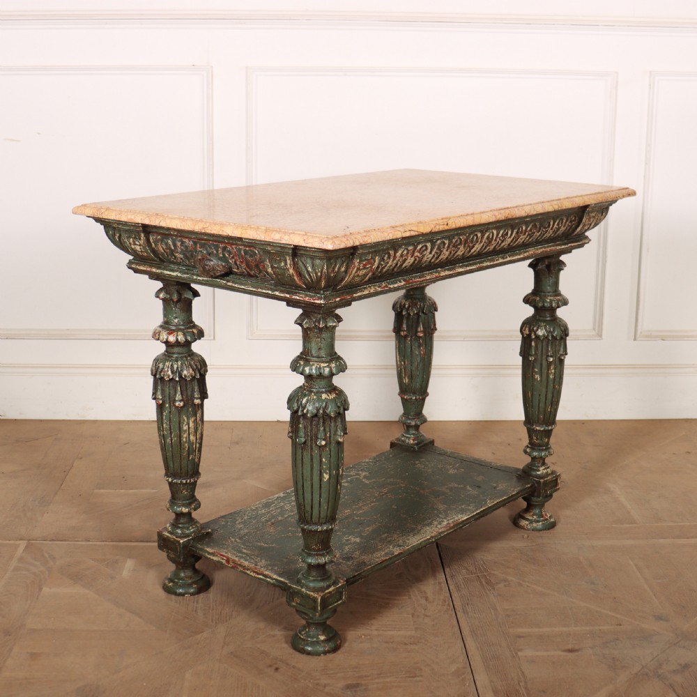A French pastry table featuring a polished light pink marble top supported by a carved distressed green painted wood base with an undertier shelf. View VI
