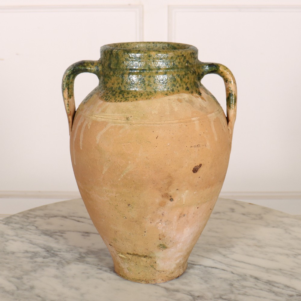 A two-handled terracotta water pot featuring an unglazed buff body and a green glaze around the rim and neck. View II