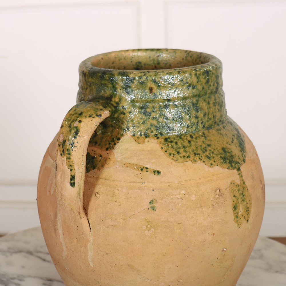 A two-handled terracotta water pot featuring an unglazed buff body and a green glaze around the rim and neck. View III