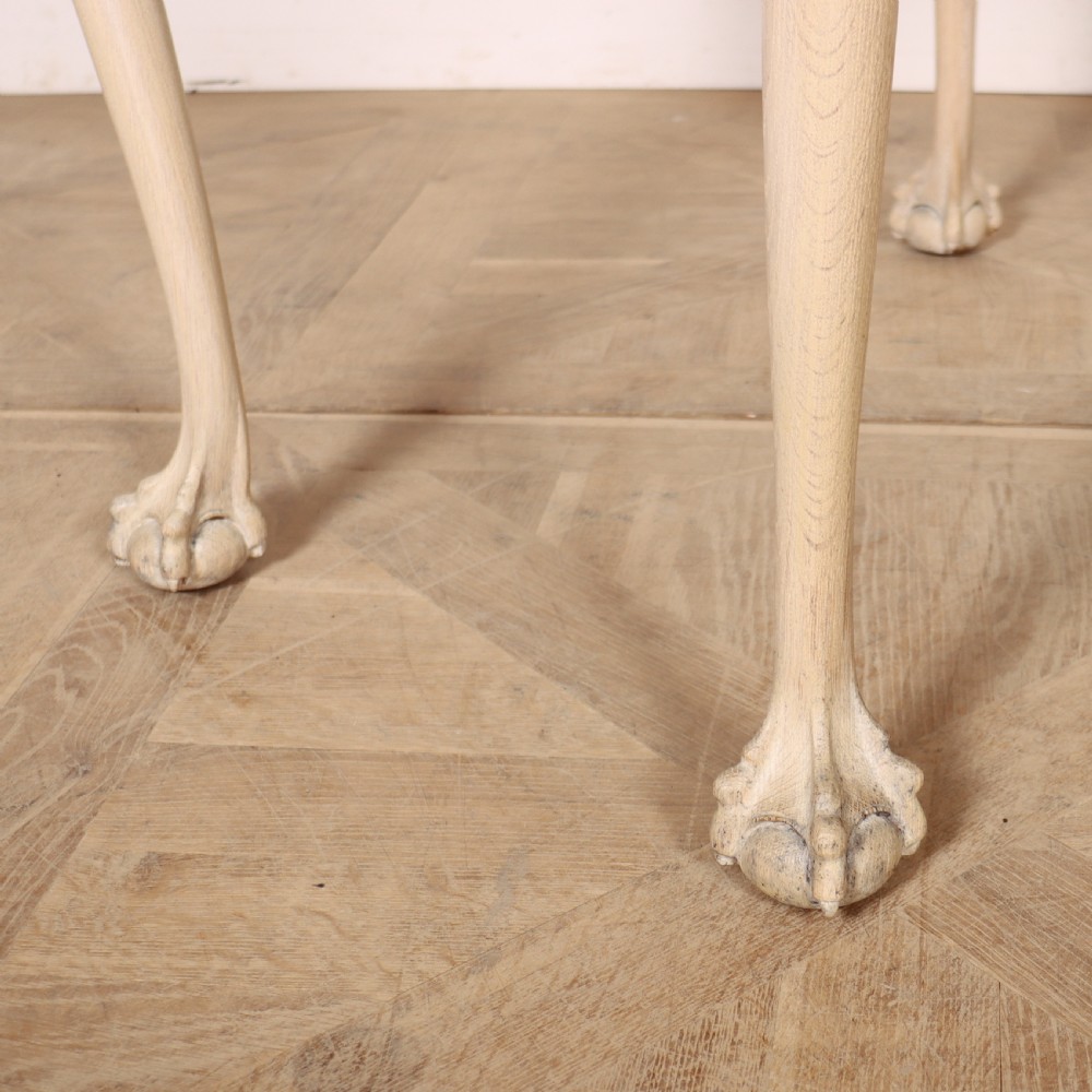 A bleached oak lamp table featuring carved cabriole legs with claw-and-ball feet, acanthus knee carvings, and a single drawer with twin brass drop handles. View V