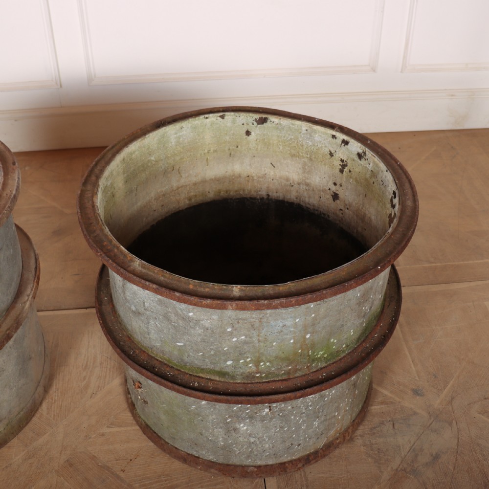 A pair of cylindrical weathered zinc planters featuring rusty iron rims and mid-bands with a distressed aged finish. View III