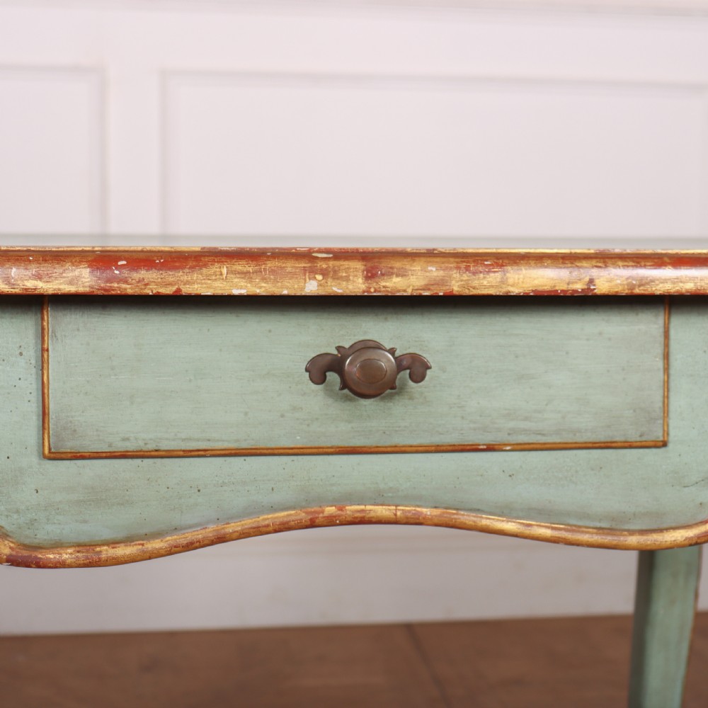 A sage green painted wooden side table featuring gilt trim, a serpentine edge, a single drawer, and four slender cabriole legs. View II