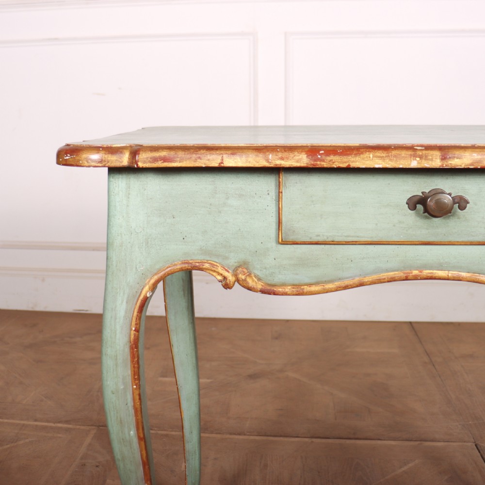 A sage green painted wooden side table featuring gilt trim, a serpentine edge, a single drawer, and four slender cabriole legs. View III
