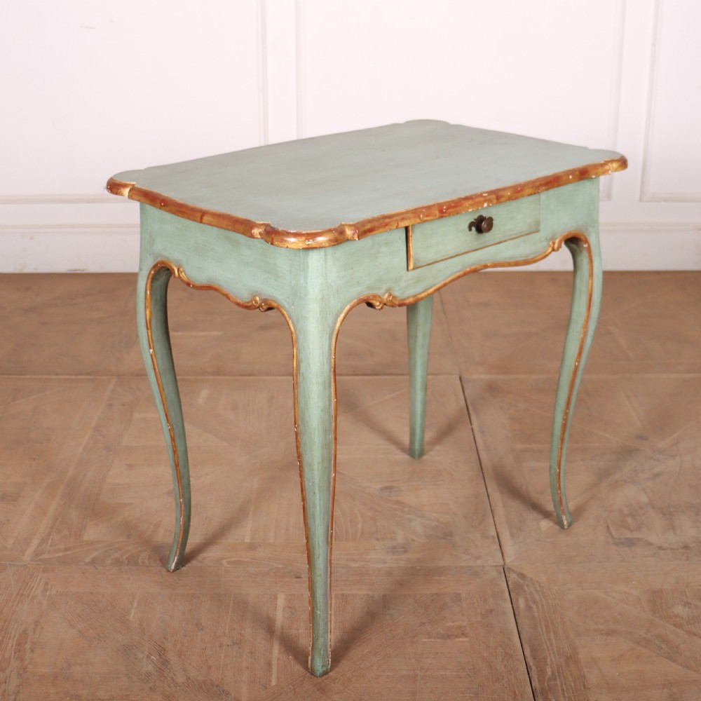 A sage green painted wooden side table featuring gilt trim, a serpentine edge, a single drawer, and four slender cabriole legs. View V