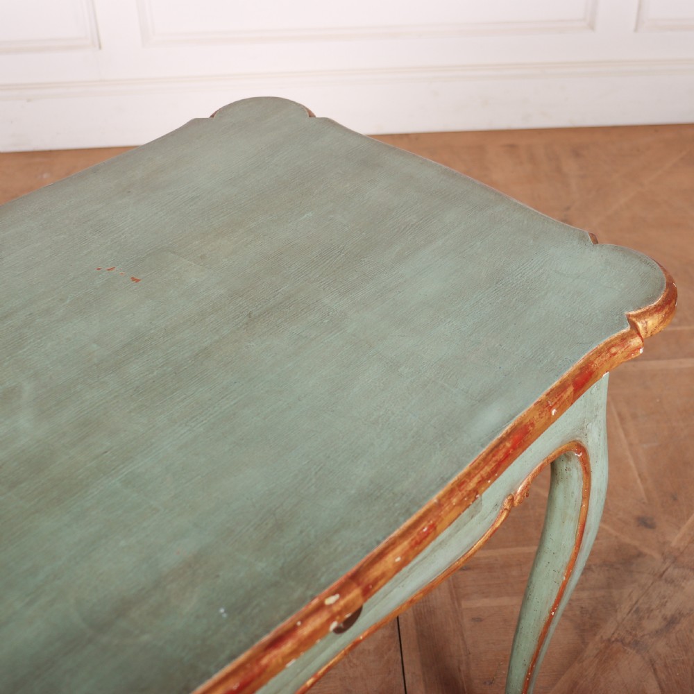 A sage green painted wooden side table featuring gilt trim, a serpentine edge, a single drawer, and four slender cabriole legs. View VII