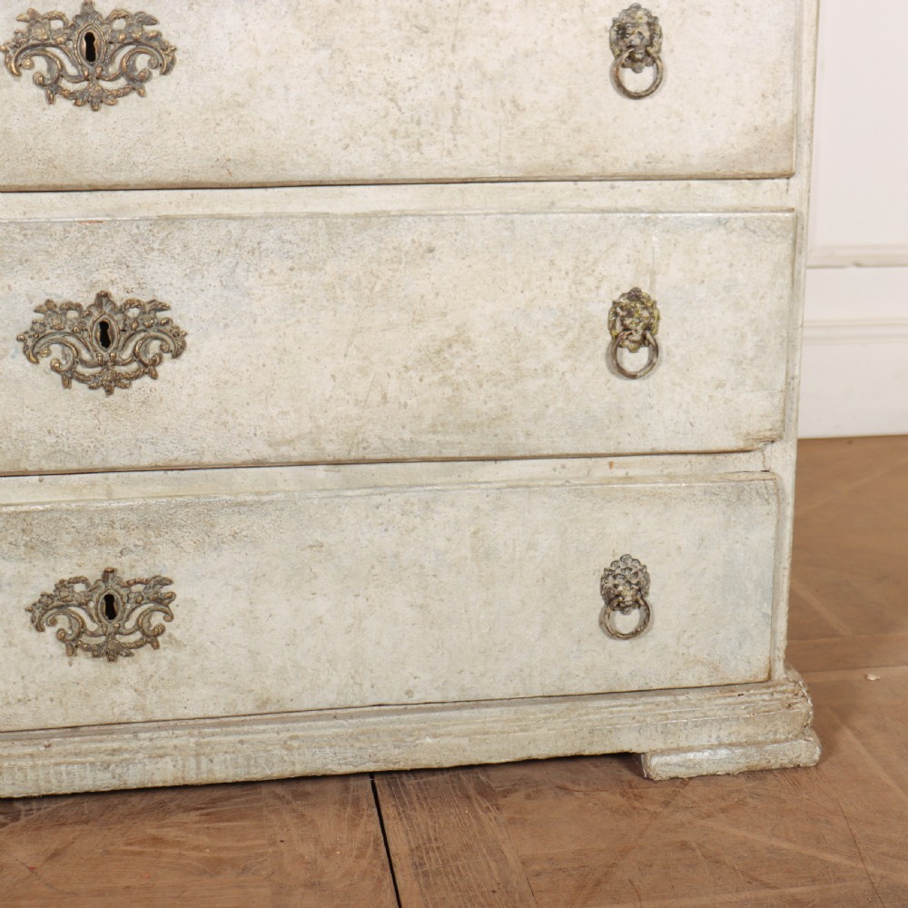 An off-white painted Danish bureau bookcase with a gallery-topped upper cupboard, stepped side drawers, a slant-front desk, and lower drawers fitted with brass lion-head ring handles. View III