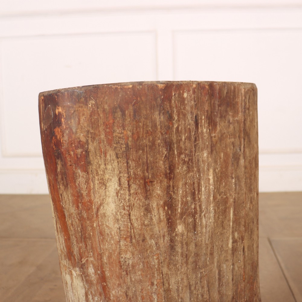 A cylindrical rustic vessel crafted from a hollowed-out tree trunk with weathered natural wood grain. View IV