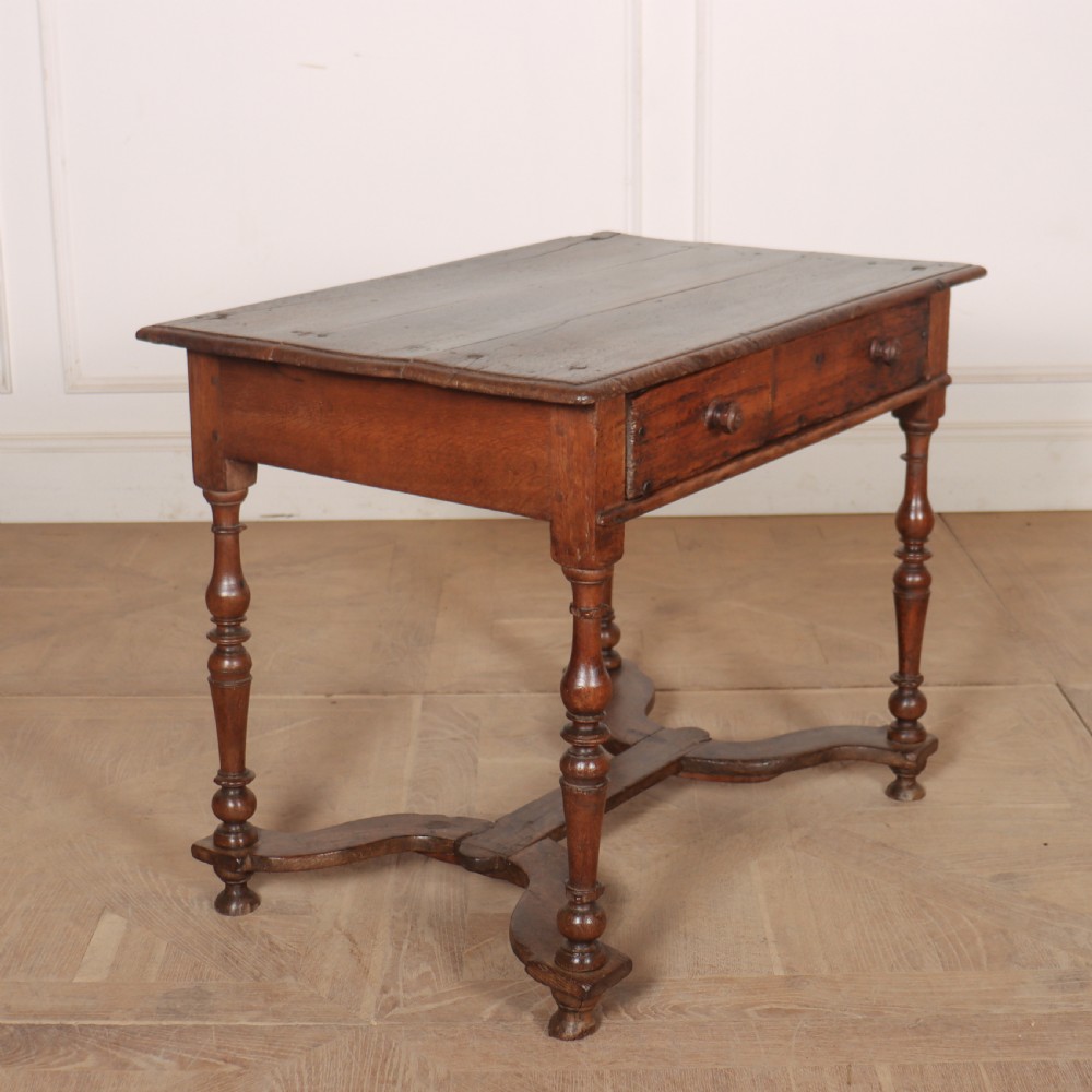 An 18th-century oak side table with a single frieze drawer, turned legs, wooden knobs, and a shaped lower stretcher. View VI