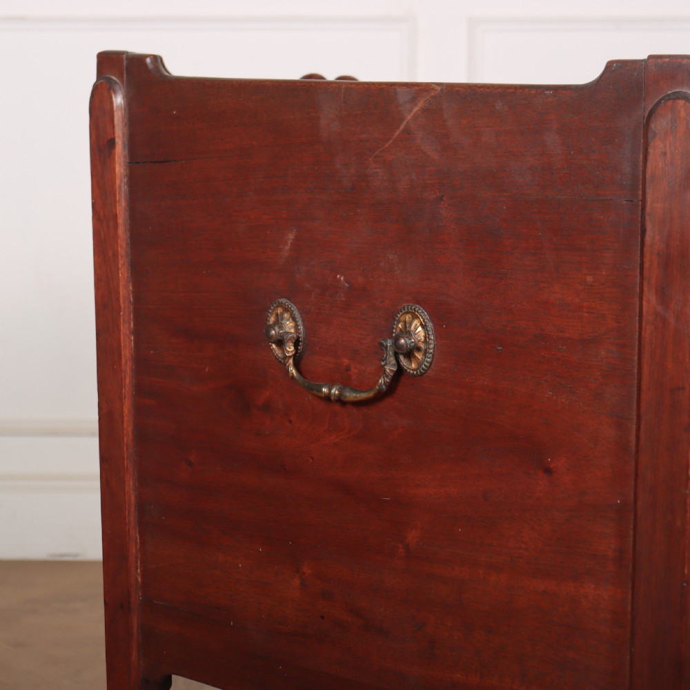 A Georgian mahogany tray-top bedside table featuring a double-door cupboard above a single drawer with a brass drop handle, supported by straight square legs. View VII