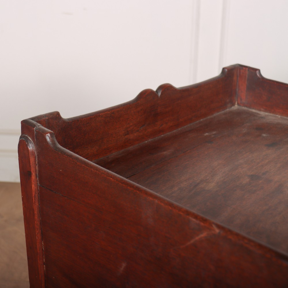 A Georgian mahogany tray-top bedside table featuring a double-door cupboard above a single drawer with a brass drop handle, supported by straight square legs. View VIII