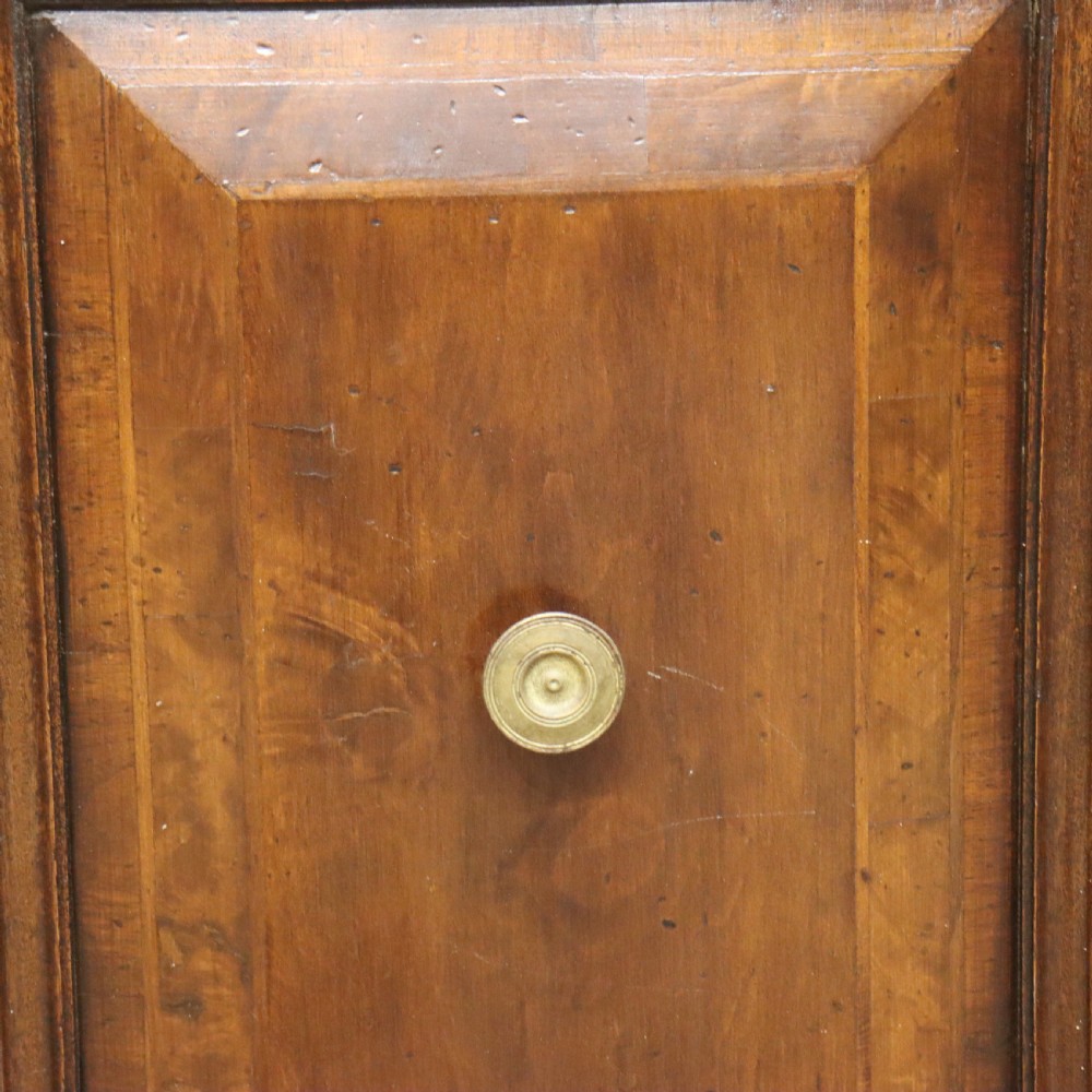A large Italian dark walnut bookcase featuring four upper glass doors, four small drawers, and four fielded panel doors below. View VIII