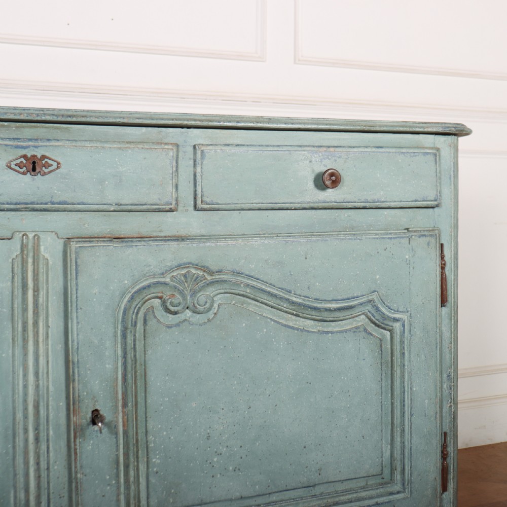 A 19th-century French provincial painted wooden buffet with three drawers above two carved panel doors in a distressed soft blue finish. View V