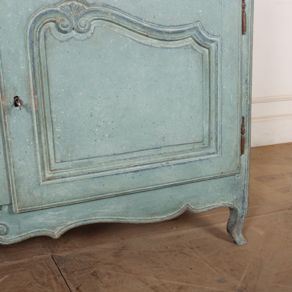 A 19th-century French provincial painted wooden buffet with three drawers above two carved panel doors in a distressed soft blue finish. View VI