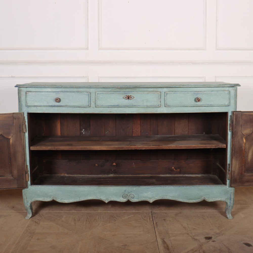 A 19th-century French provincial painted wooden buffet with three drawers above two carved panel doors in a distressed soft blue finish. View VII