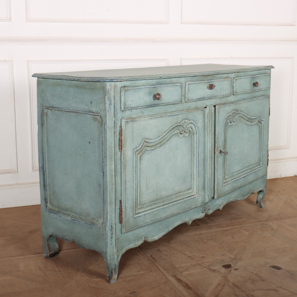A 19th-century French provincial painted wooden buffet with three drawers above two carved panel doors in a distressed soft blue finish. View VIII