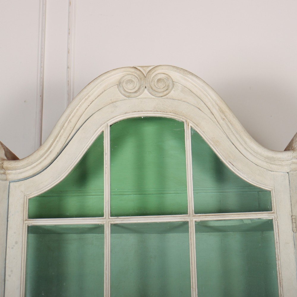 An 18th-century Dutch painted vitrine cabinet featuring an arched glass upper display section with green shelves over a double-door lower storage cupboard. View II