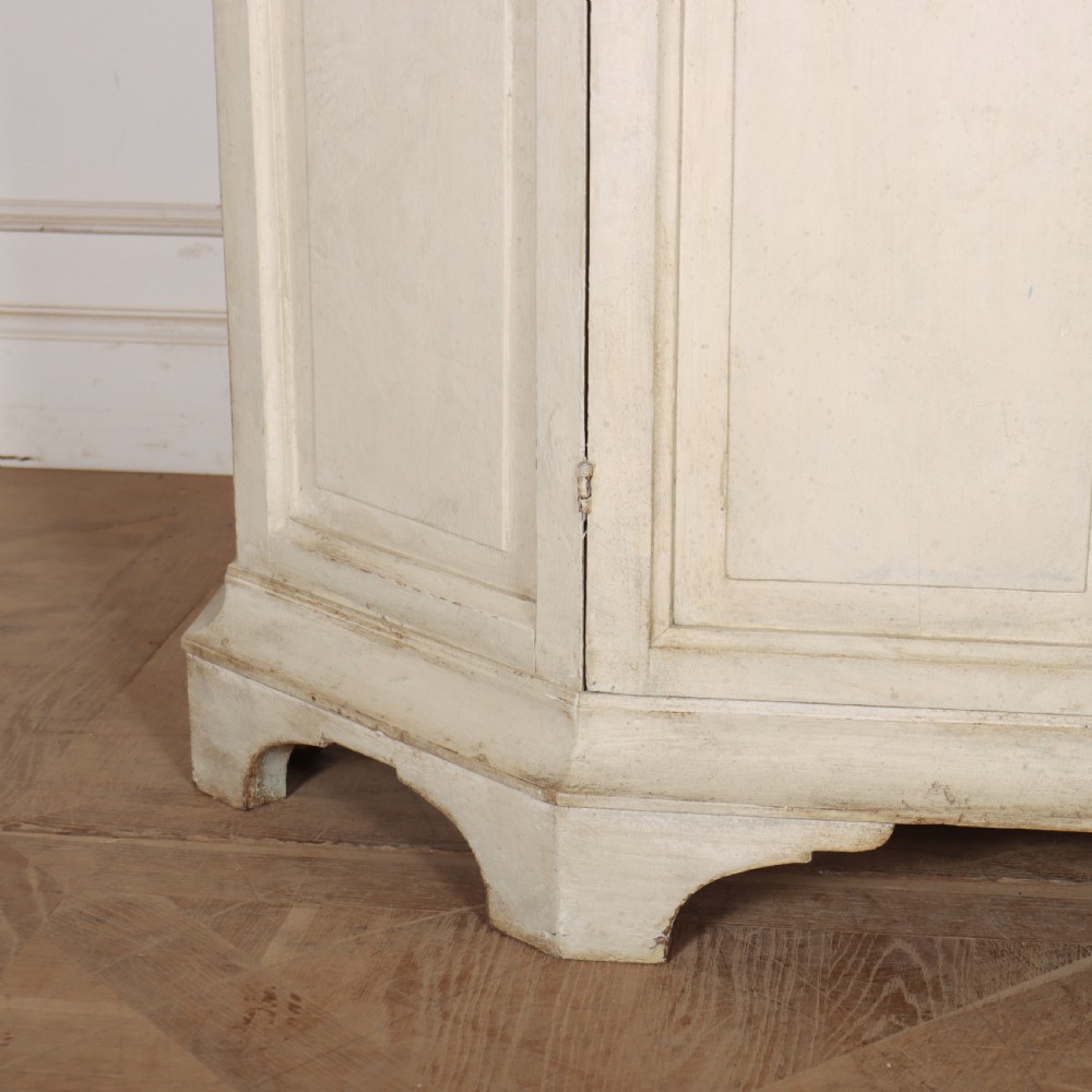 An 18th-century Dutch painted vitrine cabinet featuring an arched glass upper display section with green shelves over a double-door lower storage cupboard. View III