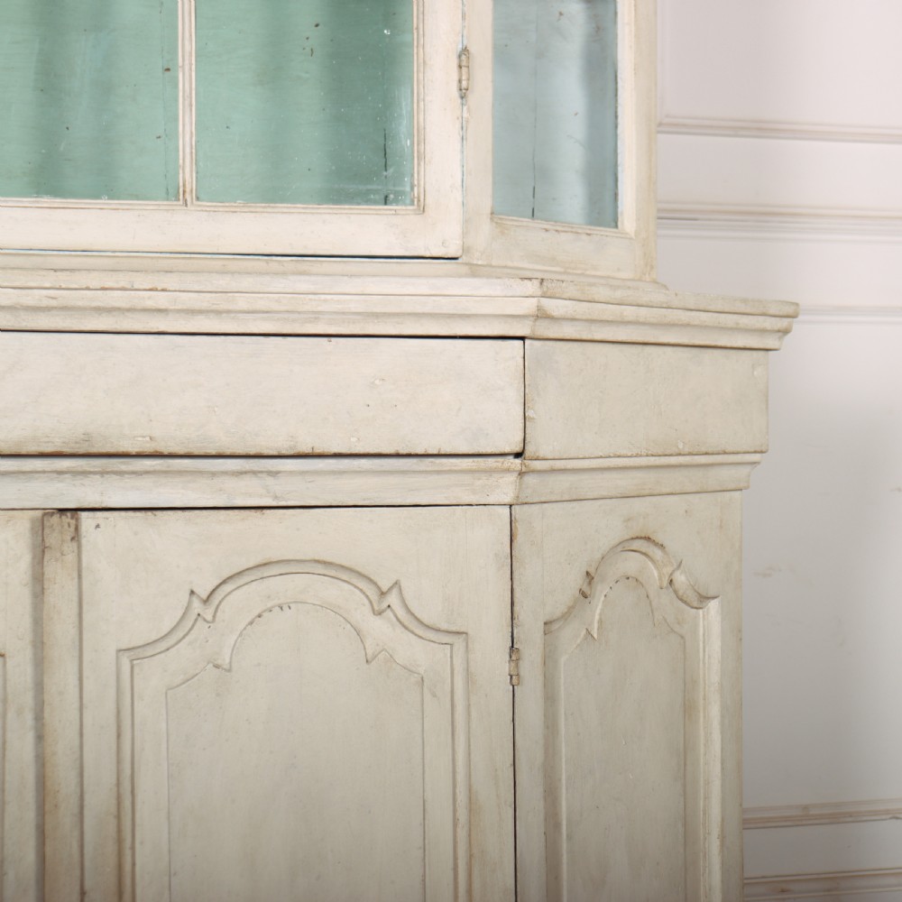 An 18th-century Dutch painted vitrine cabinet featuring an arched glass upper display section with green shelves over a double-door lower storage cupboard. View IV