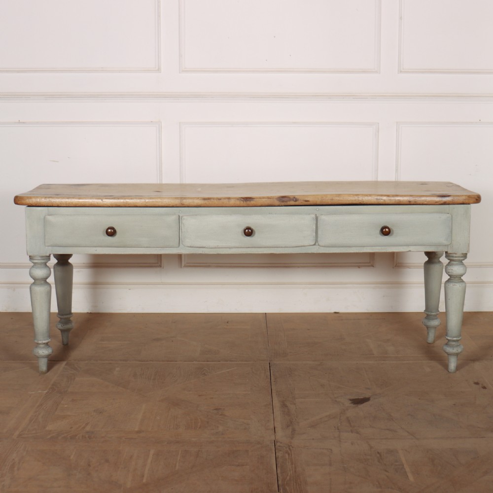 A 19th-century Welsh painted server featuring a natural wood top, three drawers with turned handles, and grey painted turned legs.