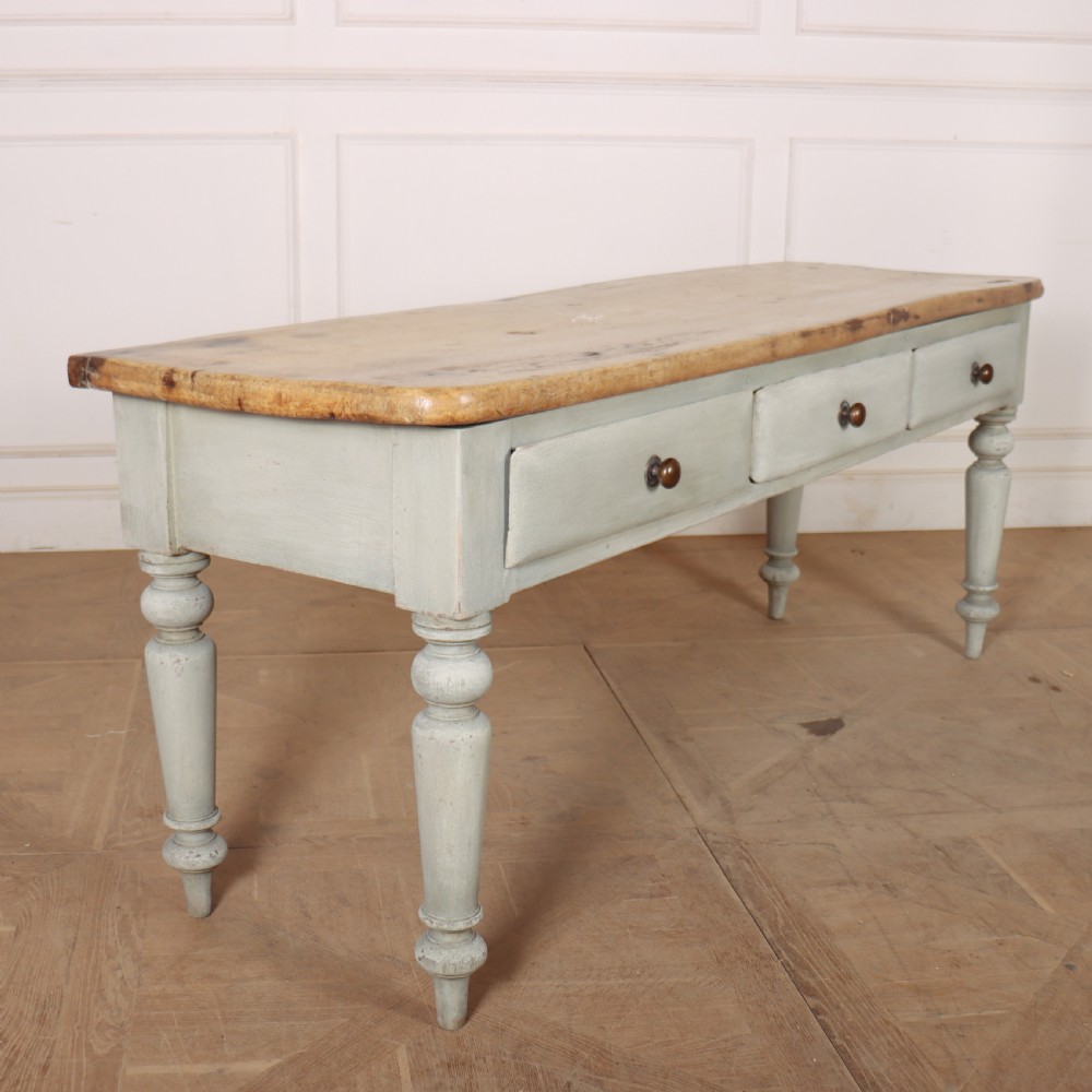 A 19th-century Welsh painted server featuring a natural wood top, three drawers with turned handles, and grey painted turned legs. View V