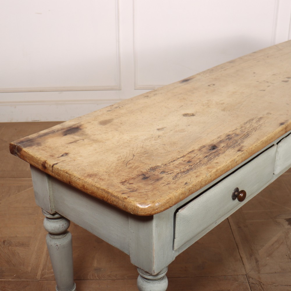 A 19th-century Welsh painted server featuring a natural wood top, three drawers with turned handles, and grey painted turned legs. View VI