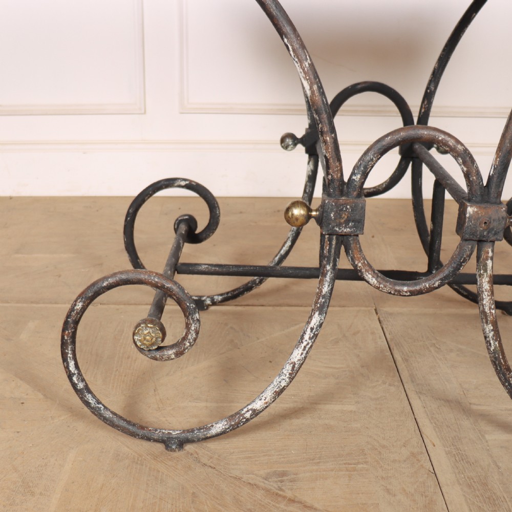A 19th-century French patisserie table featuring a light marble top mounted on a dark wrought iron scrolled base with brass details. View III