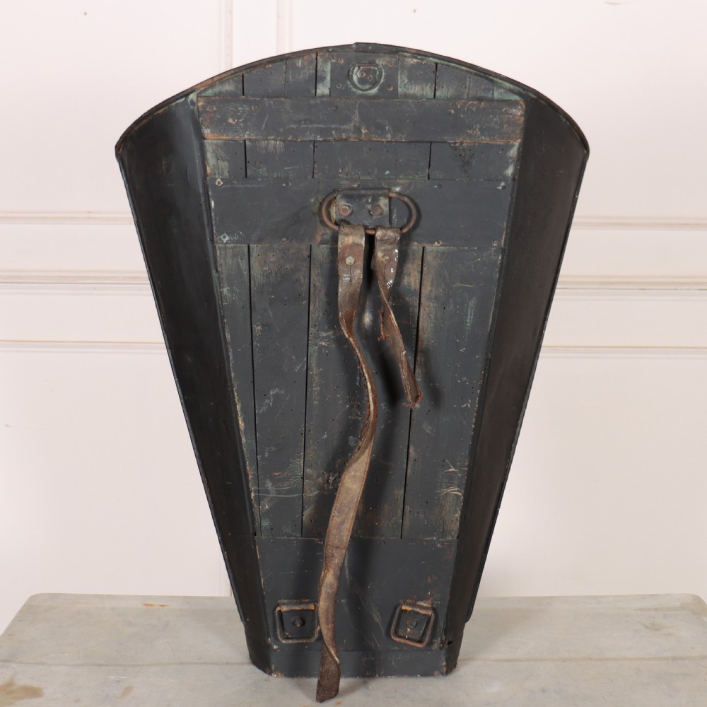 A tapered black painted sheet metal grape picking hotte with gold hand-painted lettering reading Chateauneuf du-Pape and a crest motif. View V