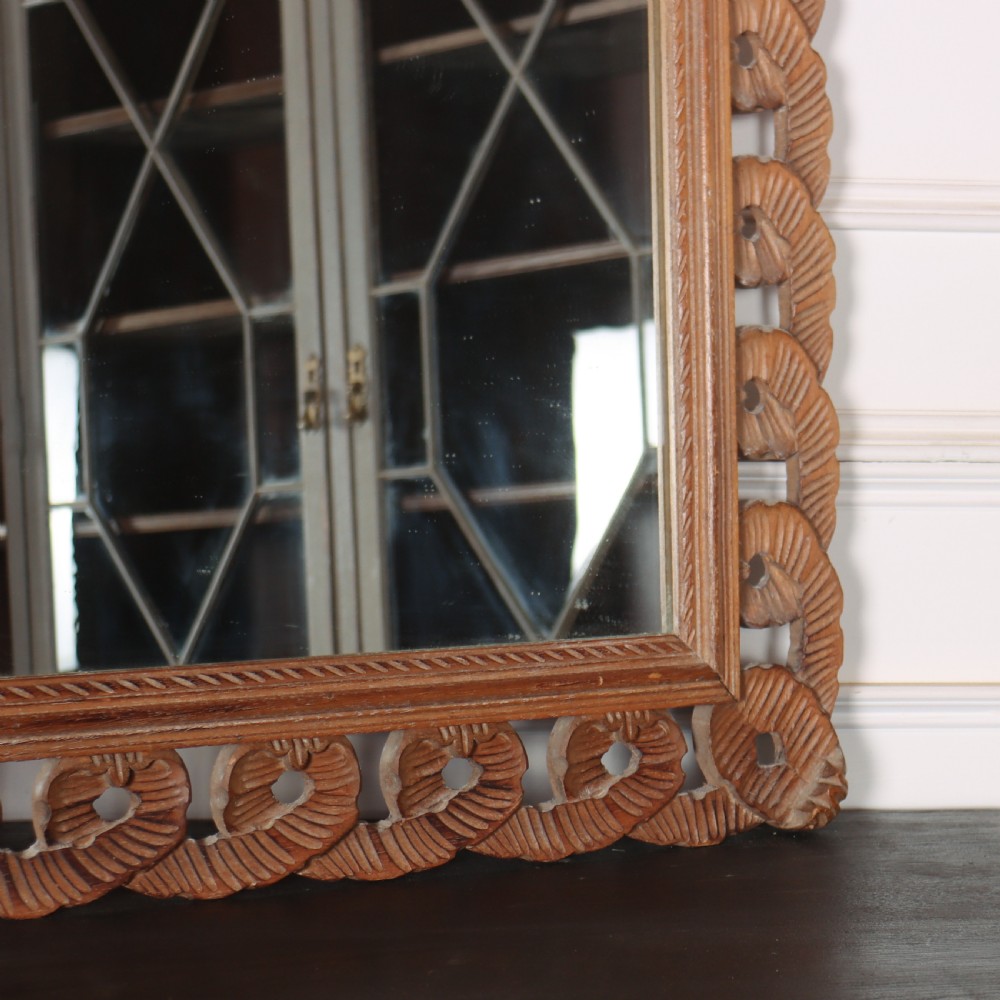 A rectangular wall mirror featuring an intricate hand-carved pine frame with an openwork twist pattern and warm wood finish. View IV
