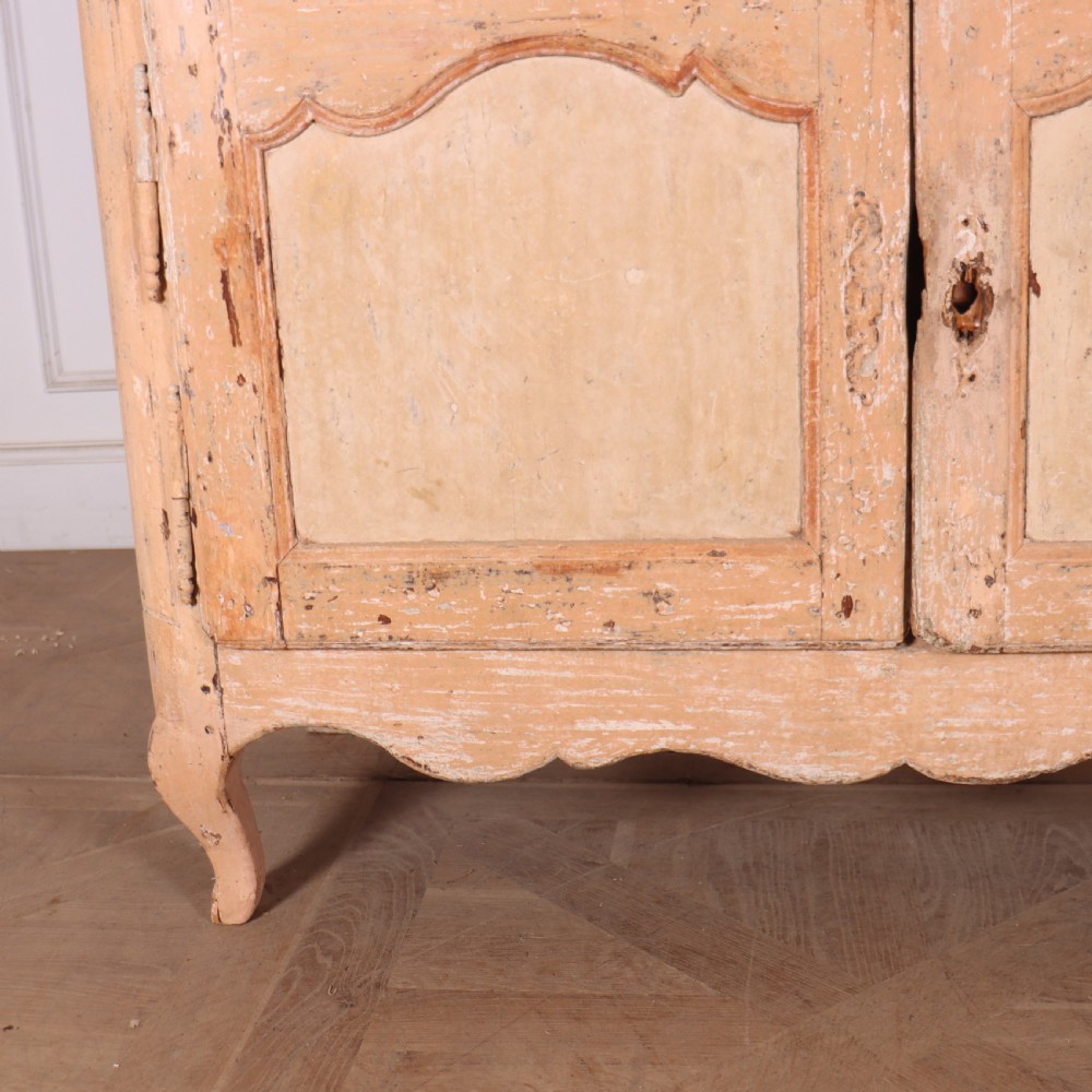 An 18th-century French provincial buffet featuring a distressed beige painted finish, two drawers, two carved panel cupboard doors, and short cabriole legs. View III