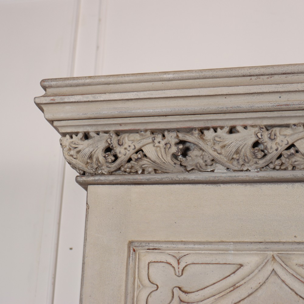 A large 19th-century painted wooden three-door wardrobe featuring carved Gothic arches and a detailed crown moulding cornice. View II