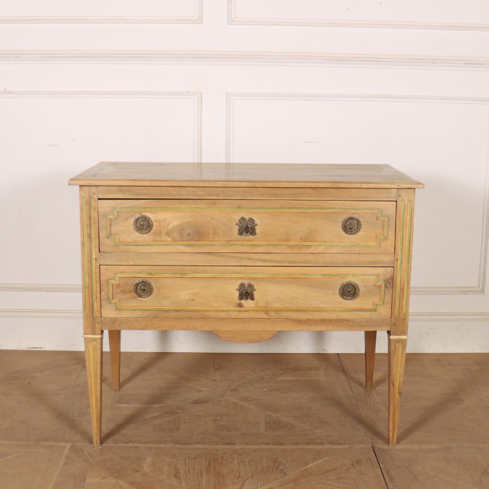 A 19th-century bleached walnut Italian commode featuring two wide drawers with painted border details, circular brass handles, and square tapered legs.