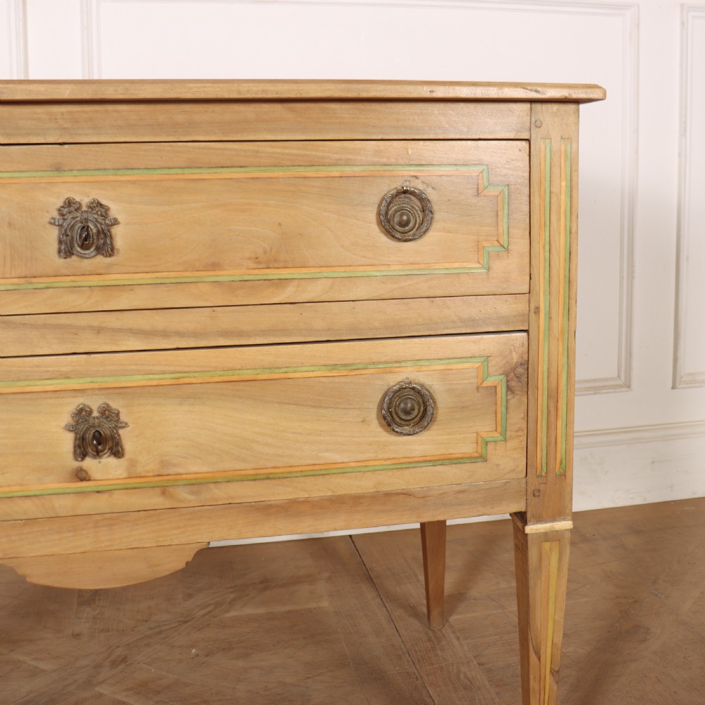 A 19th-century bleached walnut Italian commode featuring two wide drawers with painted border details, circular brass handles, and square tapered legs. View III