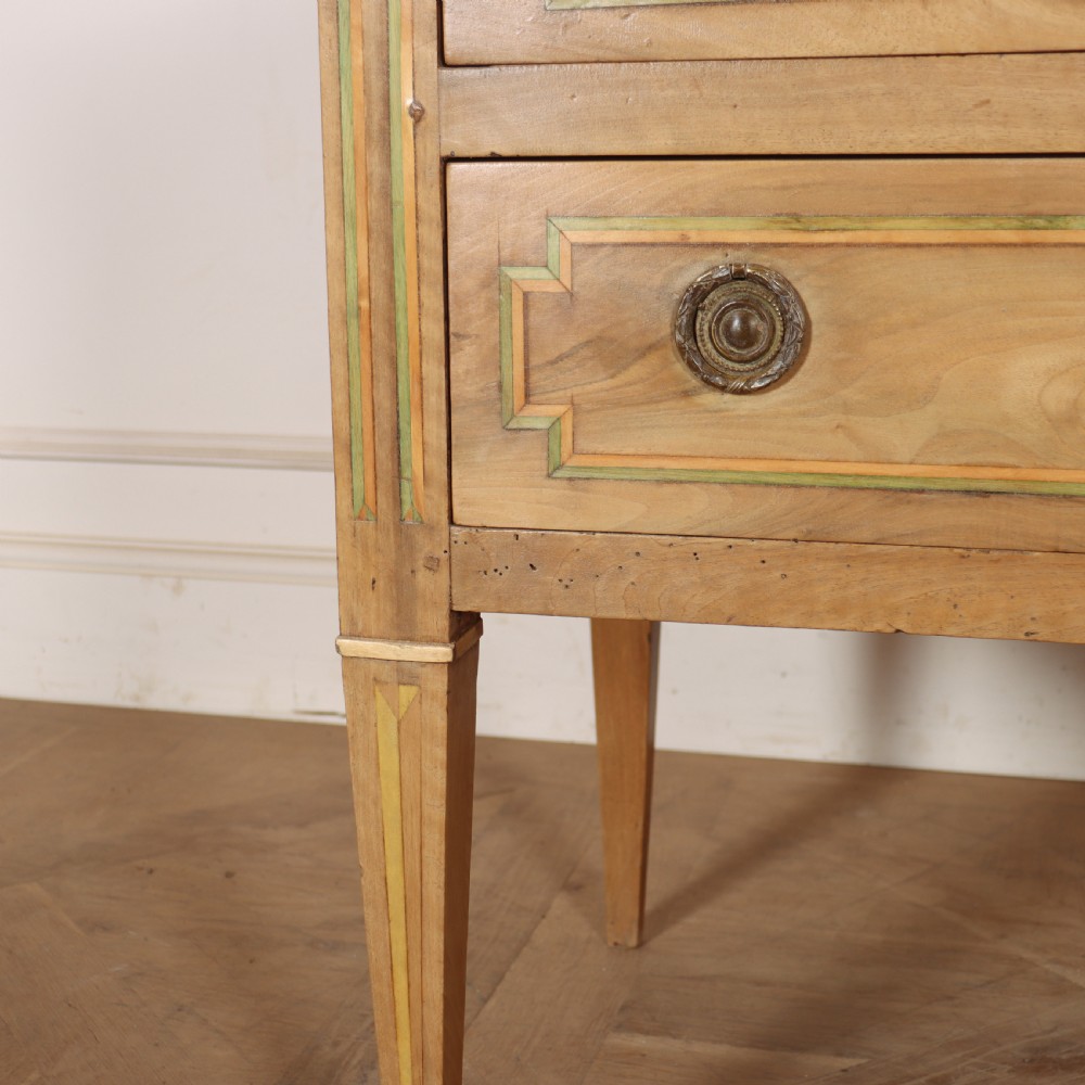 A 19th-century bleached walnut Italian commode featuring two wide drawers with painted border details, circular brass handles, and square tapered legs. View VI