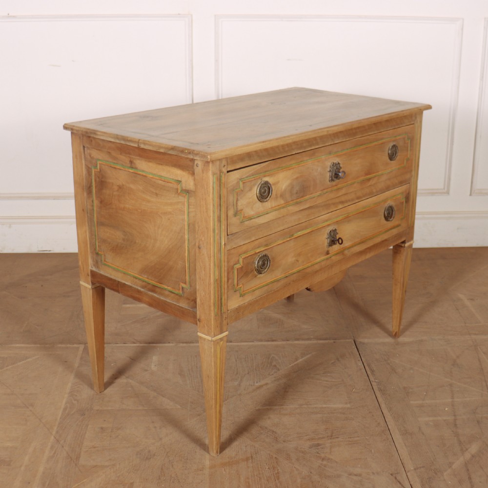 A 19th-century bleached walnut Italian commode featuring two wide drawers with painted border details, circular brass handles, and square tapered legs. View VII