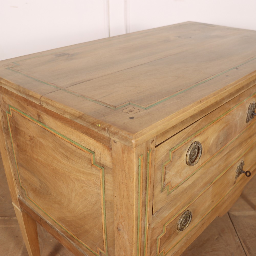 A 19th-century bleached walnut Italian commode featuring two wide drawers with painted border details, circular brass handles, and square tapered legs. View VIII