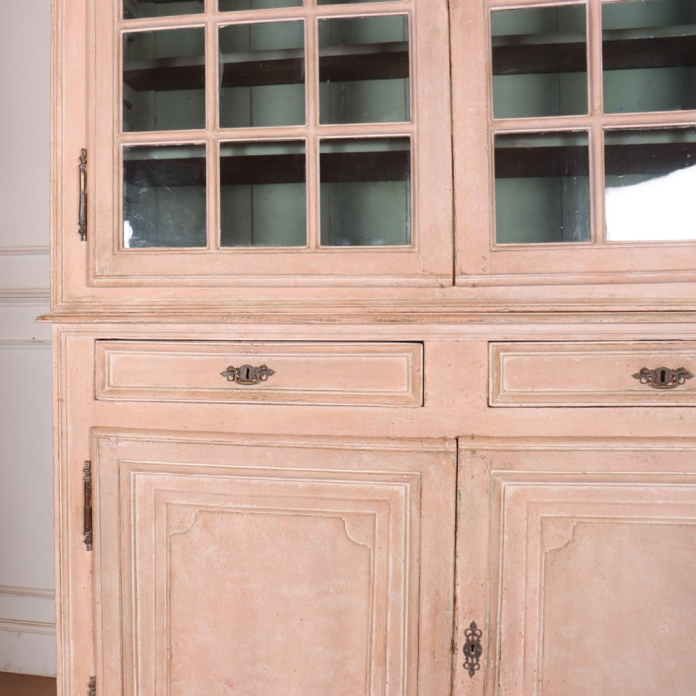 A nineteenth-century French painted glazed dresser featuring arched multi-pane glass doors with a green interior above two drawers and cupboard doors. View II