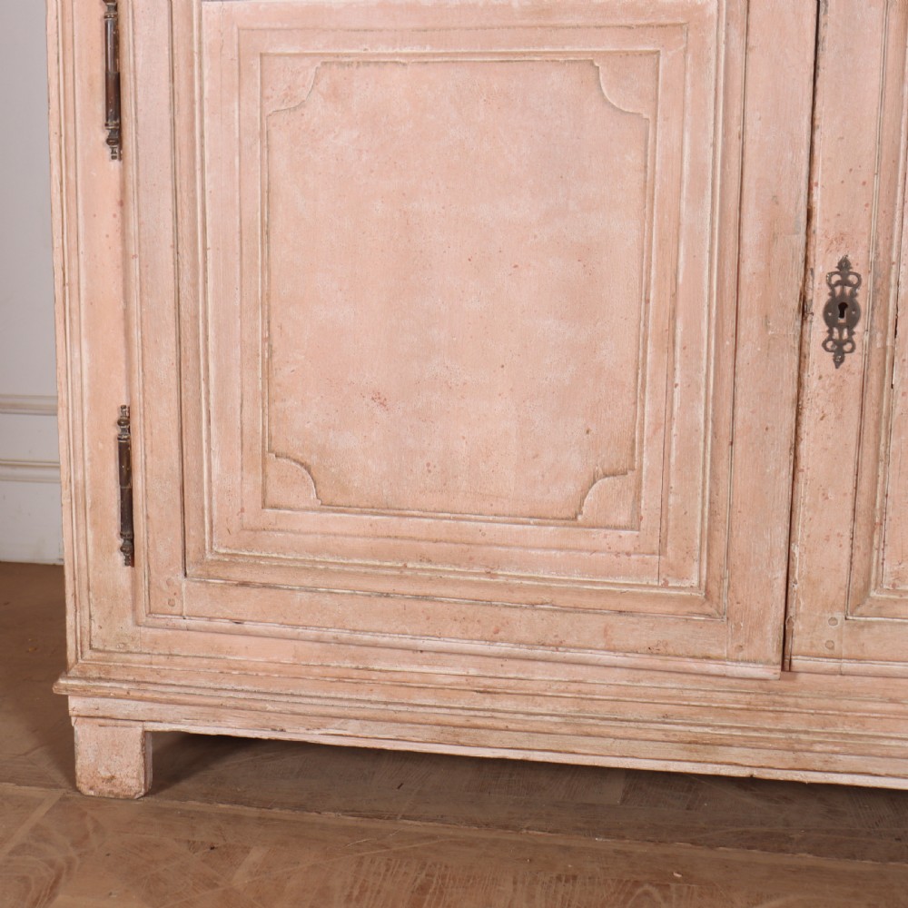 A nineteenth-century French painted glazed dresser featuring arched multi-pane glass doors with a green interior above two drawers and cupboard doors. View III