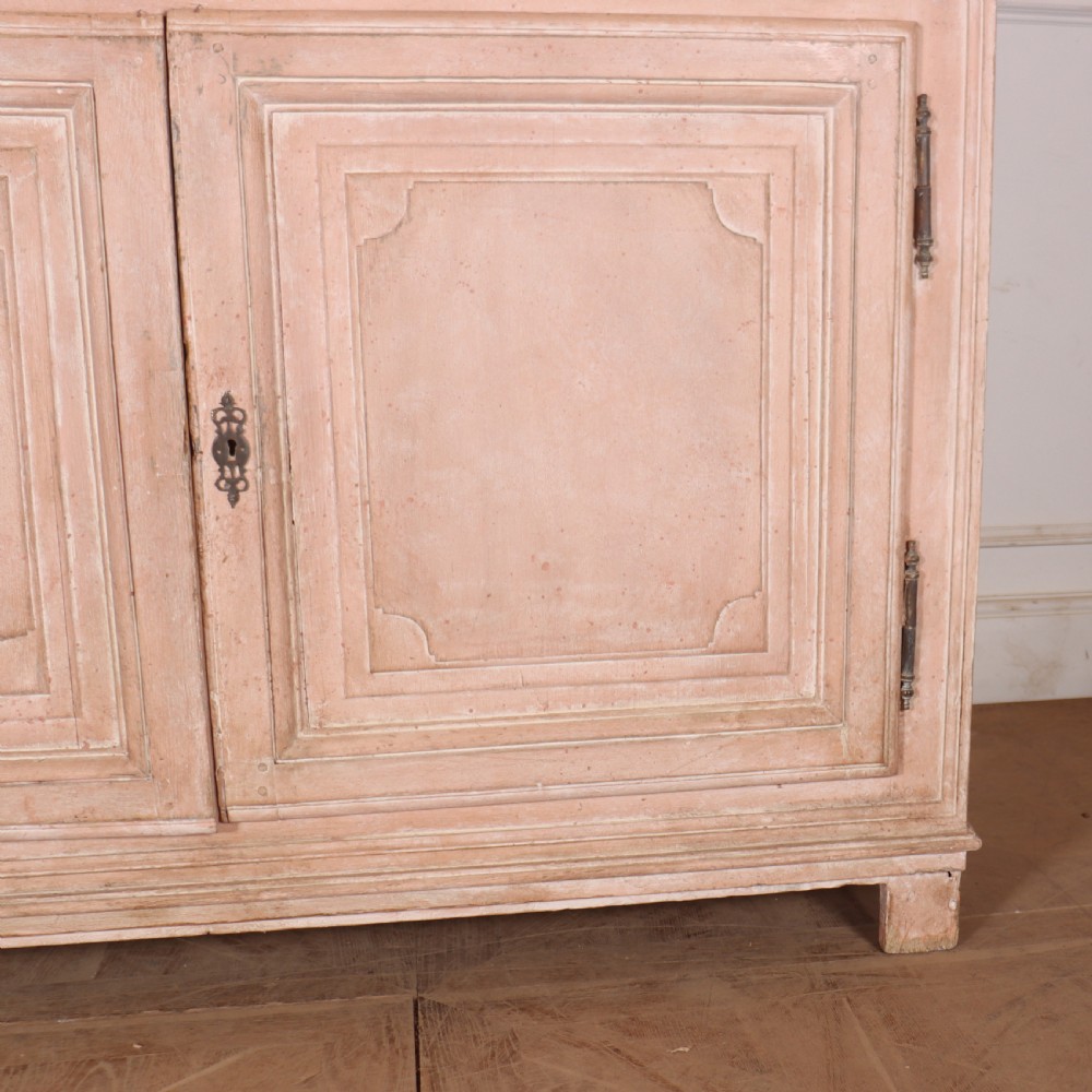 A nineteenth-century French painted glazed dresser featuring arched multi-pane glass doors with a green interior above two drawers and cupboard doors. View VI