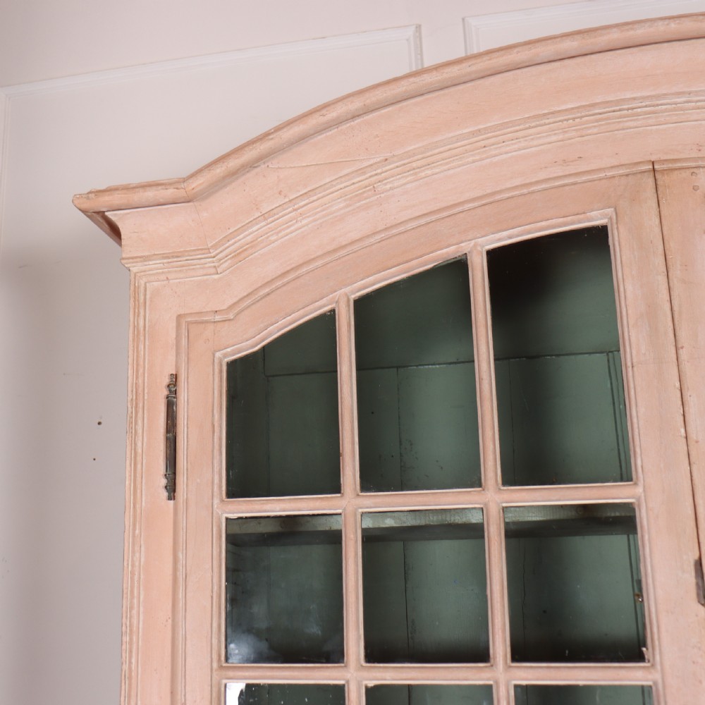 A nineteenth-century French painted glazed dresser featuring arched multi-pane glass doors with a green interior above two drawers and cupboard doors. View VII