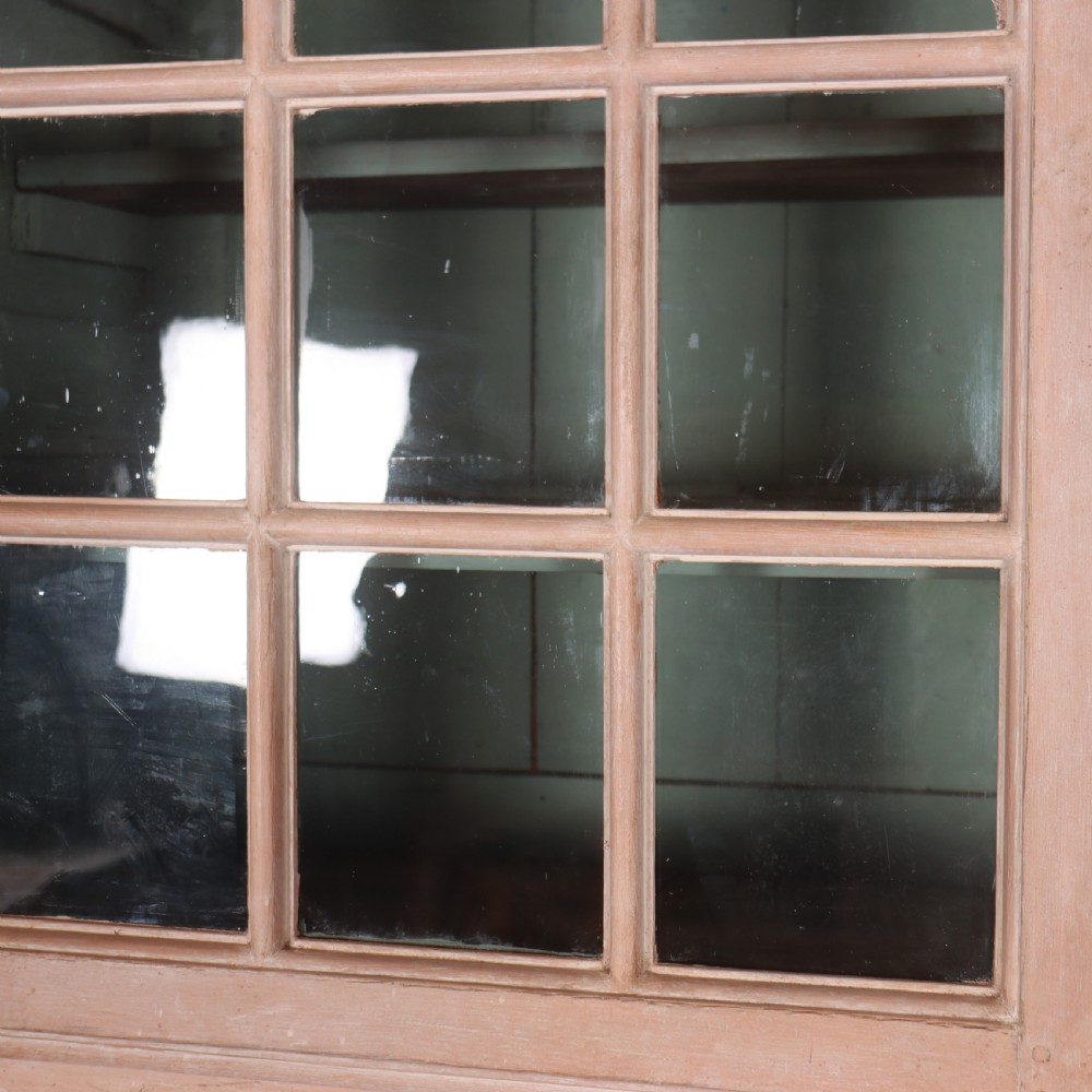 A nineteenth-century French painted glazed dresser featuring arched multi-pane glass doors with a green interior above two drawers and cupboard doors. View IX