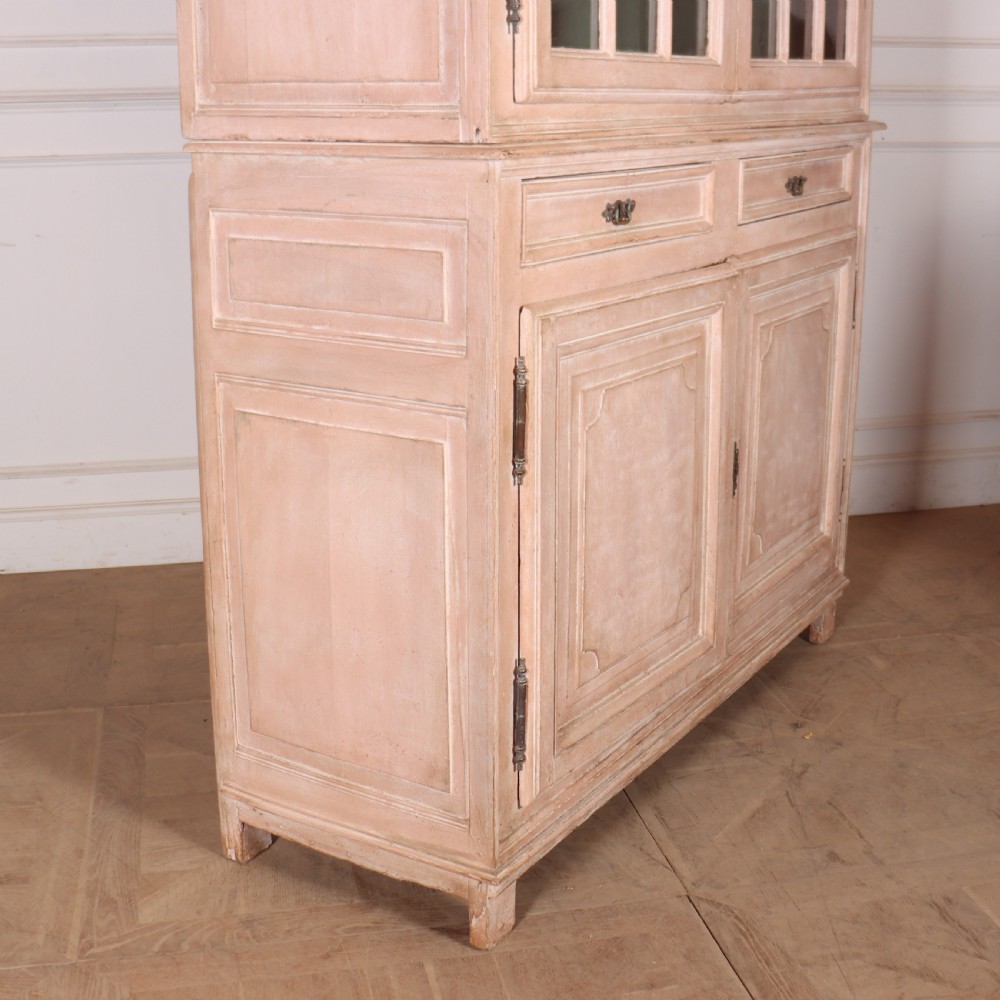 A nineteenth-century French painted glazed dresser featuring arched multi-pane glass doors with a green interior above two drawers and cupboard doors. View XI