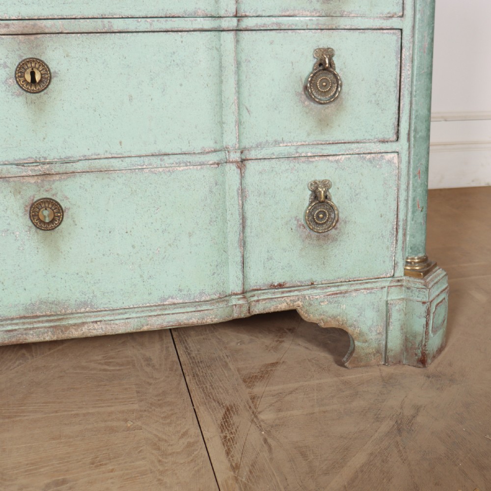 An 18th-century Dutch breakfront commode featuring a pale green painted finish, four drawers with brass ring handles, and a light marble top. View V