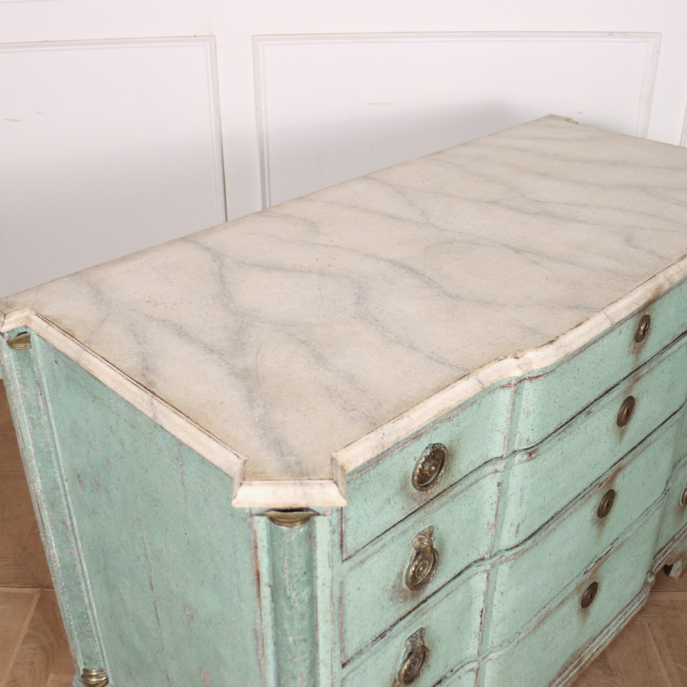 An 18th-century Dutch breakfront commode featuring a pale green painted finish, four drawers with brass ring handles, and a light marble top. View XII