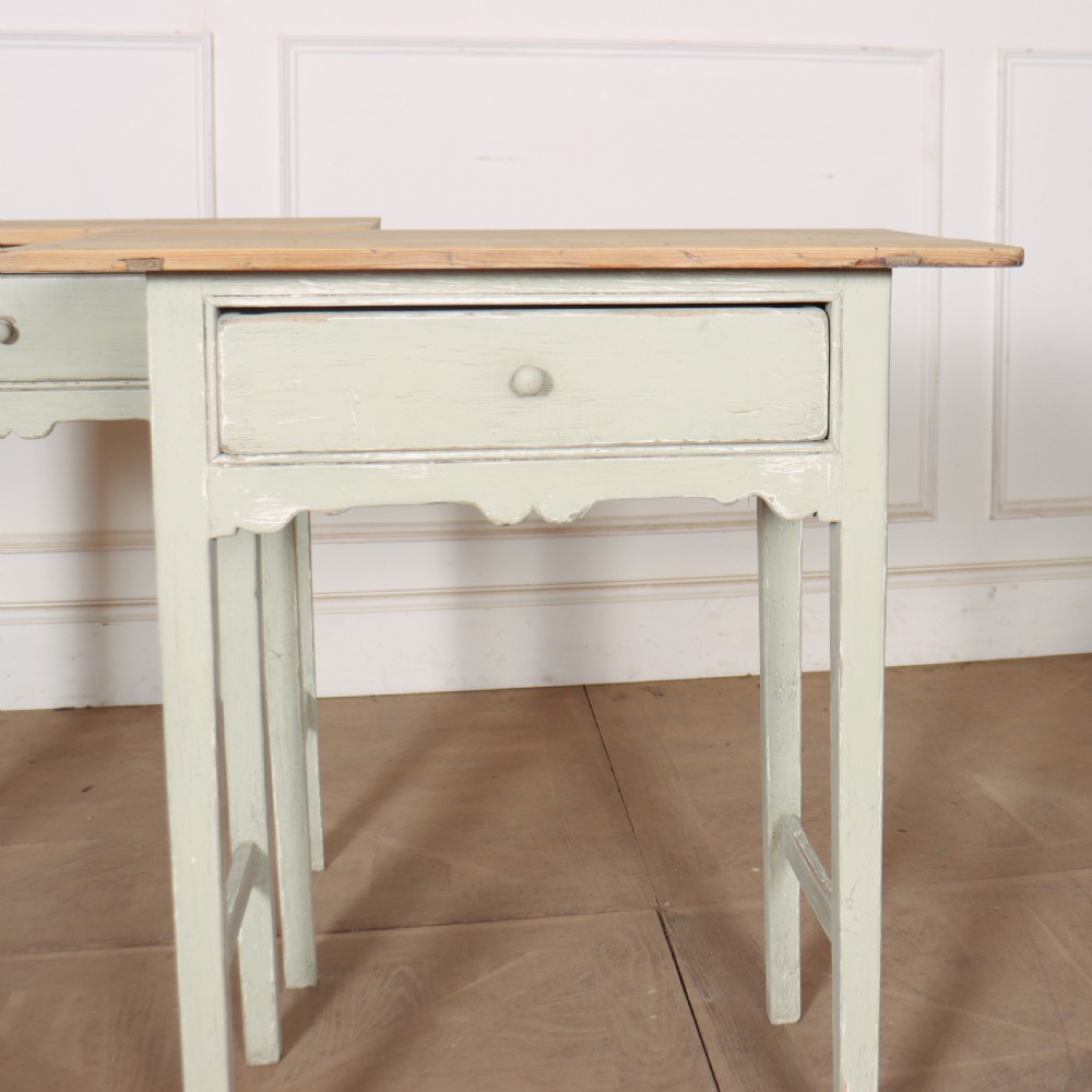 A pair of 19th-century English side tables featuring natural pine tops, single frieze drawers, and pale green painted bases with square tapered legs. View II
