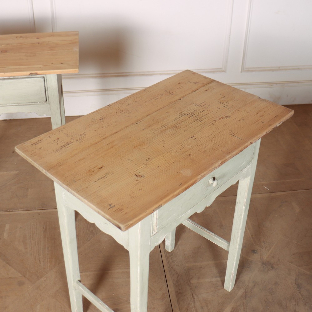 A pair of 19th-century English side tables featuring natural pine tops, single frieze drawers, and pale green painted bases with square tapered legs. View III